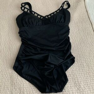 Black swimsuit with cutout detail on the neck.NWOT